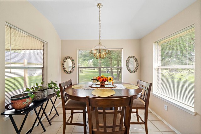 907 S Peach Hollow Ct, Pearland, TX 77584 - dining area with a chandelier, light tile patterned floors, lofted ceiling, and baseboards