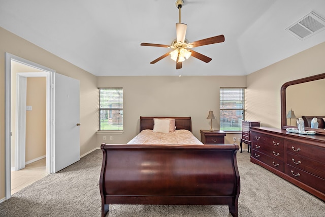 907 S Peach Hollow Ct, Pearland, TX 77584 - bedroom featuring multiple windows, light carpet, a ceiling fan, baseboards, and vaulted ceiling