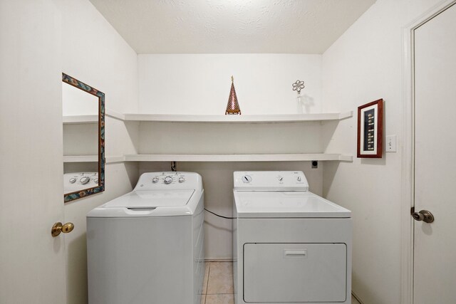 907 S Peach Hollow Ct, Pearland, TX 77584 - washroom with separate washer and dryer and light tile patterned floors