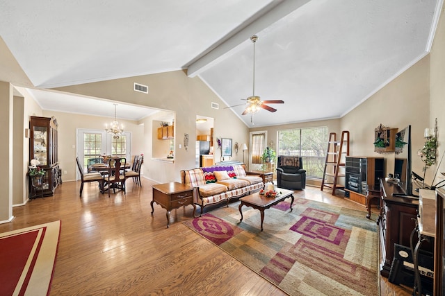 907 S Peach Hollow Ct, Pearland, TX 77584 - living room with healthy amount of natural light, wood finished floors, ceiling fan, and a chandelier