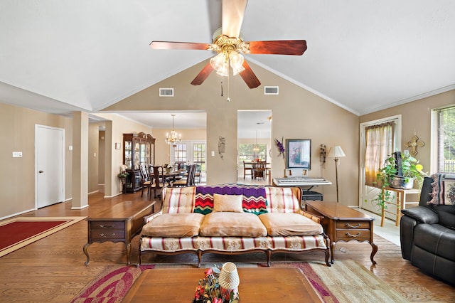 907 S Peach Hollow Ct, Pearland, TX 77584 - living room with a ceiling fan, wood finished floors, a chandelier, high vaulted ceiling, and crown molding