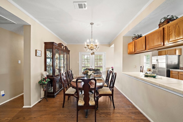 907 S Peach Hollow Ct, Pearland, TX 77584 - dining space with a chandelier, ornamental molding, dark wood-type flooring, and baseboards