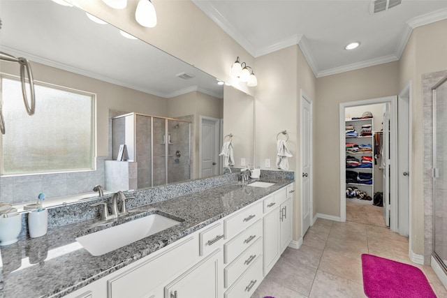 20511 Noble Ranch Ct, Richmond, TX 77407 - bathroom featuring a shower stall, double vanity, a spacious closet, tile patterned flooring, and ornamental molding