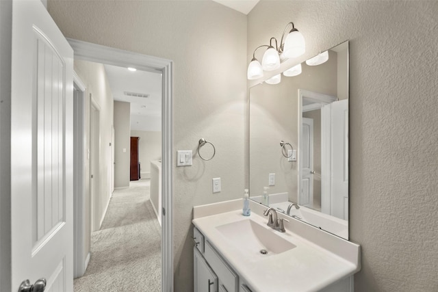 20511 Noble Ranch Ct, Richmond, TX 77407 - bathroom with a textured wall and vanity