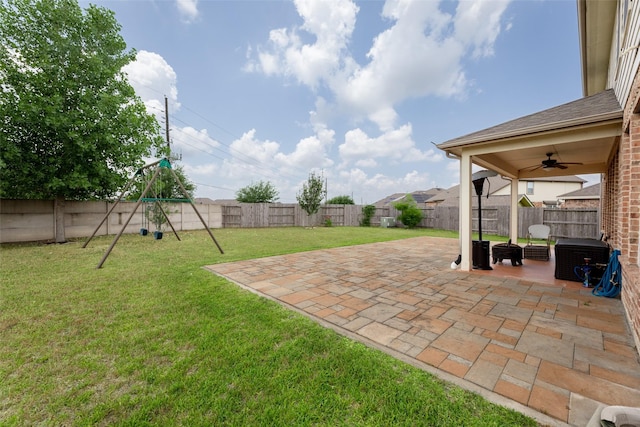 20511 Noble Ranch Ct, Richmond, TX 77407 - view of yard with a ceiling fan, a patio area, and a playground