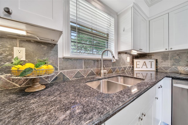 1146 Chamboard Ln, Houston, TX 77018 - kitchen with a sink, stainless steel dishwasher, white cabinetry, dark stone countertops, and backsplash