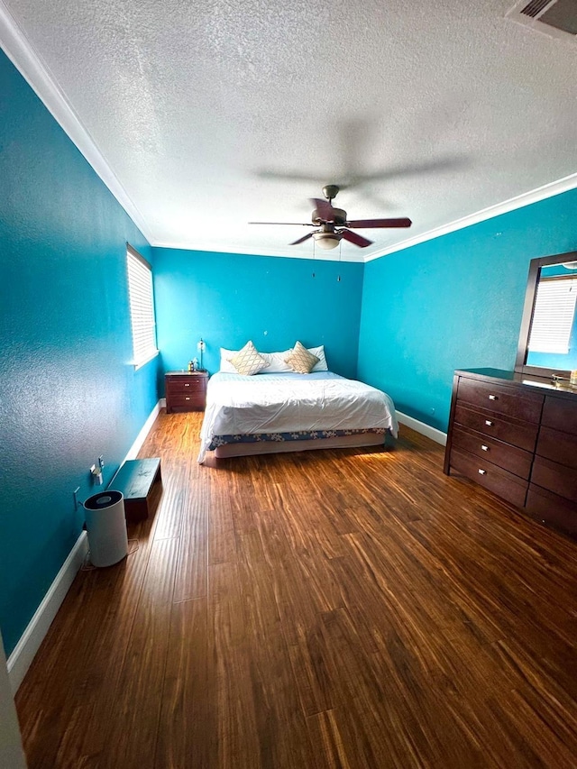 12605 Wellington Park Dr Unit 17, Houston, TX 77072 - bedroom featuring ornamental molding, a textured ceiling, baseboards, wood finished floors, and a ceiling fan