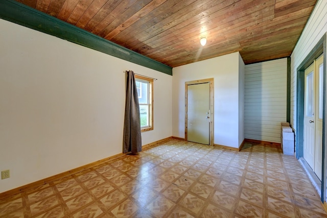 213 N Austin St, Brenham, TX 77833 - spare room with wood ceiling, baseboards, and light floors
