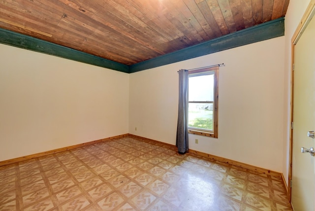 213 N Austin St, Brenham, TX 77833 - spare room with wood ceiling, light flooring, and baseboards