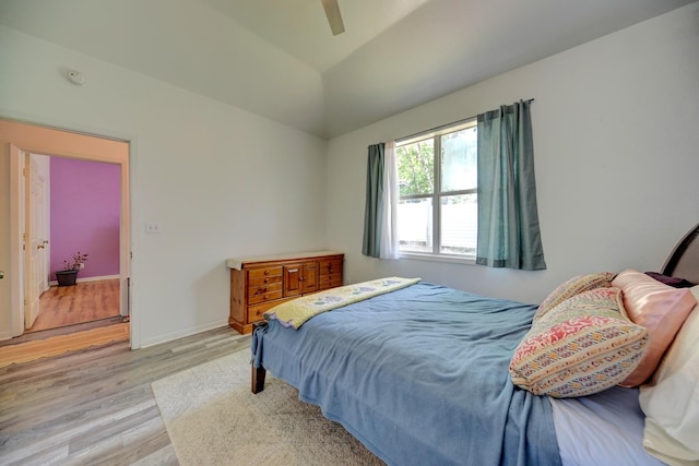 213 N Austin St, Brenham, TX 77833 - bedroom with wood finished floors, lofted ceiling, and ceiling fan
