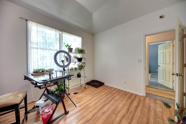 213 N Austin St, Brenham, TX 77833 - home office with light wood-style flooring, vaulted ceiling, and baseboards