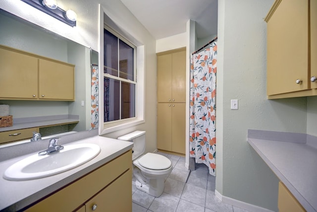 213 N Austin St, Brenham, TX 77833 - full bath featuring vanity, toilet, tile patterned flooring, curtained shower, and baseboards