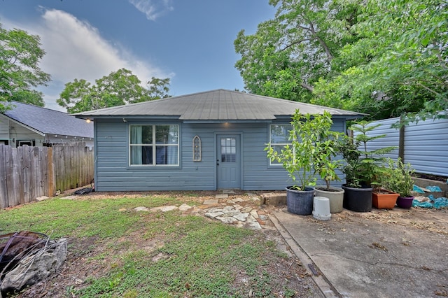 213 N Austin St, Brenham, TX 77833 - view of front of property with a fenced backyard and metal roof