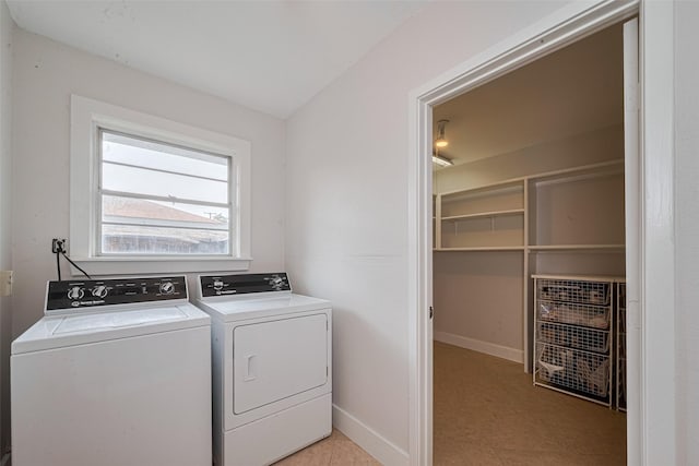10318 Raritan Dr, Houston, TX 77043 - laundry room with independent washer and dryer and baseboards