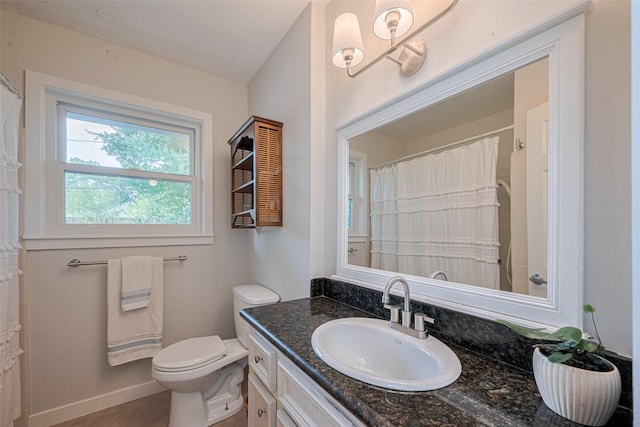 10318 Raritan Dr, Houston, TX 77043 - full bath with vanity, toilet, tile patterned flooring, baseboards, and curtained shower