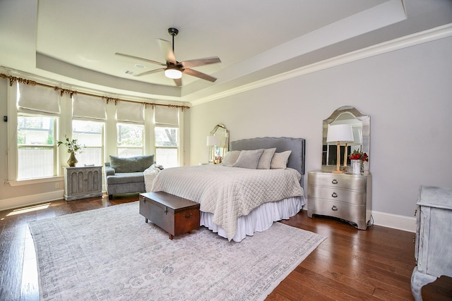 866 Myrtlea Ln, Houston, TX 77079 - bedroom with a tray ceiling, crown molding, baseboards, dark wood-type flooring, and ceiling fan