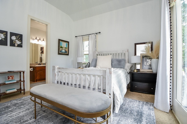 866 Myrtlea Ln, Houston, TX 77079 - carpeted bedroom with ensuite bath, a sink, and lofted ceiling