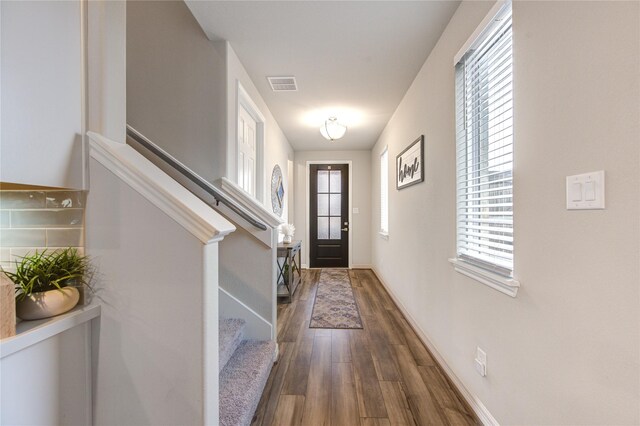 2432 Solaris Bend Dr, Katy, TX 77493 - entryway featuring dark wood-style floors, stairs, and baseboards