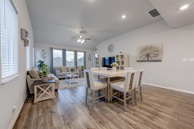 2432 Solaris Bend Dr, Katy, TX 77493 - dining area with light wood-style floors, ceiling fan, baseboards, vaulted ceiling, and recessed lighting