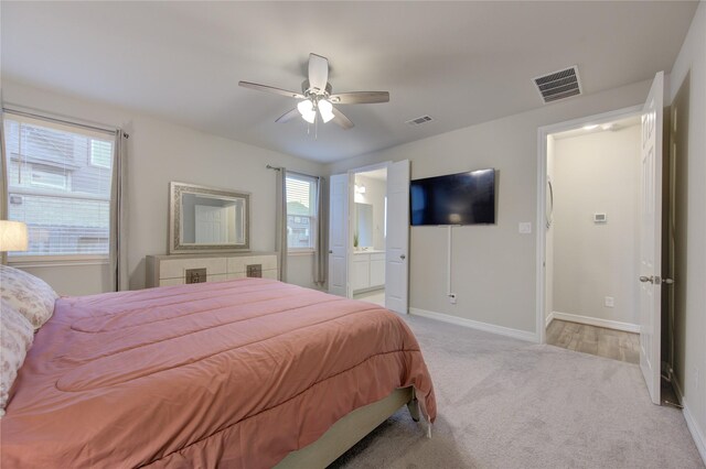 2432 Solaris Bend Dr, Katy, TX 77493 - bedroom featuring light carpet, multiple windows, baseboards, and a ceiling fan