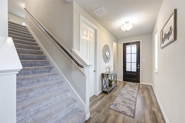 2432 Solaris Bend Dr, Katy, TX 77493 - entryway with stairway, wood finished floors, and baseboards