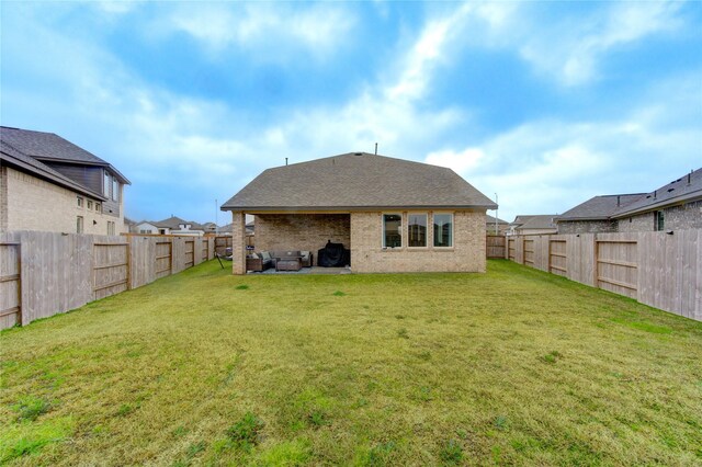 2432 Solaris Bend Dr, Katy, TX 77493 - rear view of house featuring an outdoor living space, brick siding, a shingled roof, and a patio area