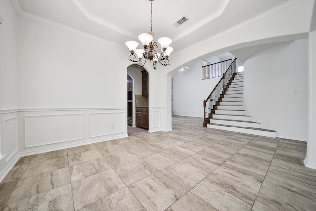 714 Stubbs Bend Dr, Rosenberg, TX 77469 - unfurnished dining area with arched walkways, a decorative wall, stairway, a raised ceiling, and a chandelier