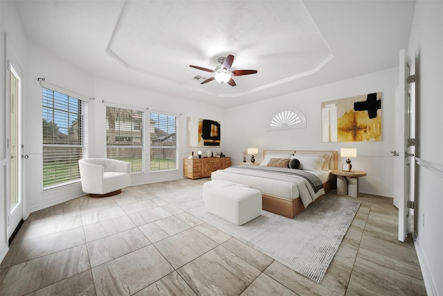 714 Stubbs Bend Dr, Rosenberg, TX 77469 - bedroom featuring a raised ceiling, a ceiling fan, and marble look tile flooring