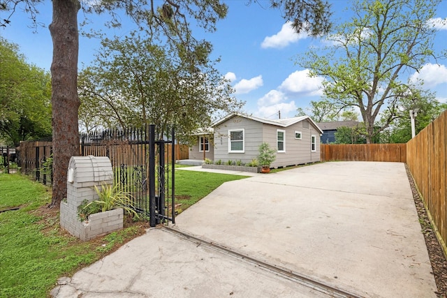 4502 Hain St, Houston, TX 77009 - rear view of house with concrete driveway and a gate