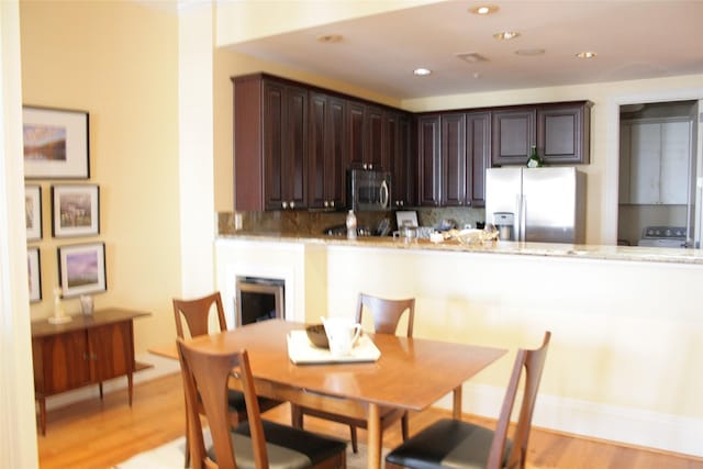 2207 Post Office St, Galveston, TX 77550 - dining room featuring light wood-type flooring and recessed lighting