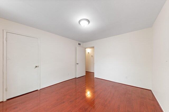 12633 Memorial Dr Unit 170, Houston, TX 77024 - unfurnished bedroom with wood finished floors