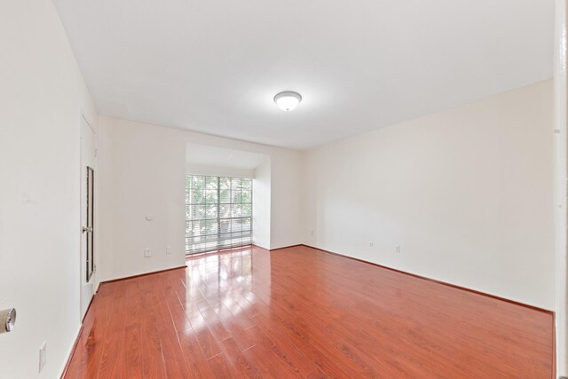 12633 Memorial Dr Unit 170, Houston, TX 77024 - spare room with wood finished floors