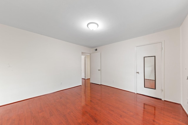 12633 Memorial Dr Unit 170, Houston, TX 77024 - spare room with wood finished floors and baseboards