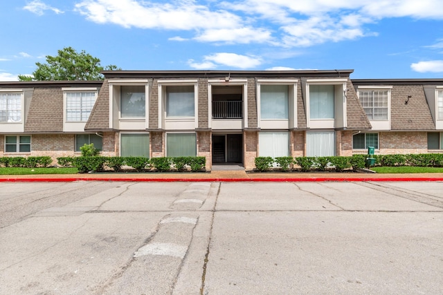 12633 Memorial Dr Unit 170, Houston, TX 77024 - view of property featuring uncovered parking