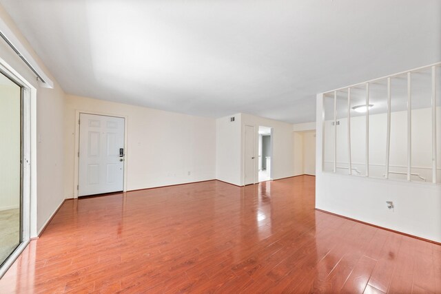 12633 Memorial Dr Unit 170, Houston, TX 77024 - empty room with wood finished floors