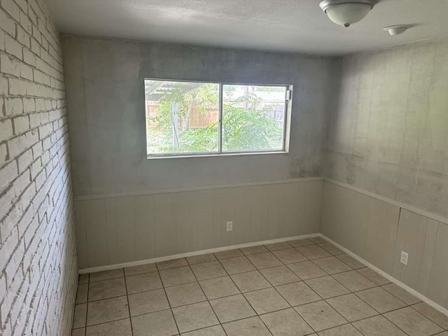 426 Pennington Dr, Corpus Christi, TX 78412 - unfurnished room with light tile patterned floors and a textured ceiling