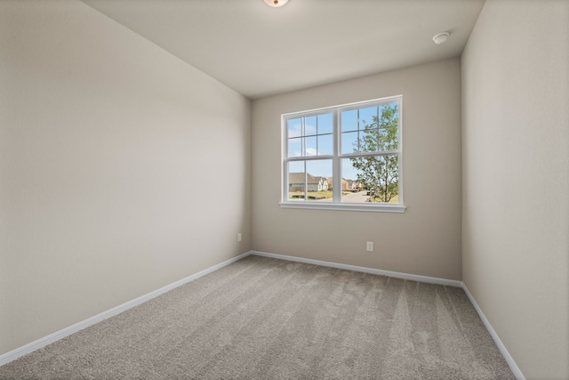 27506 Beachside Arbor Dr, Katy, TX 77493 - spare room with carpet floors, baseboards, and a smoke detector