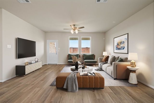 27506 Beachside Arbor Dr, Katy, TX 77493 - living area with wood finished floors, baseboards, and a ceiling fan