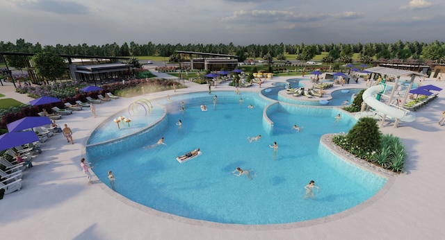 27506 Beachside Arbor Dr, Katy, TX 77493 - community pool featuring a water slide and view of wooded area