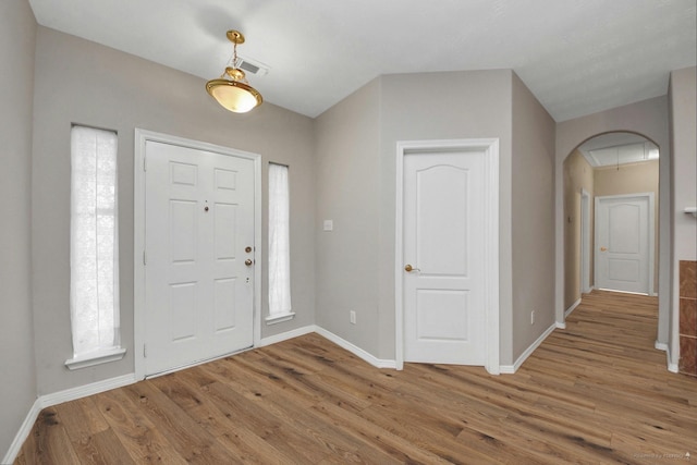 2202 Donrel Way, Houston, TX 77067 - foyer entrance with baseboards, wood finished floors, and arched walkways