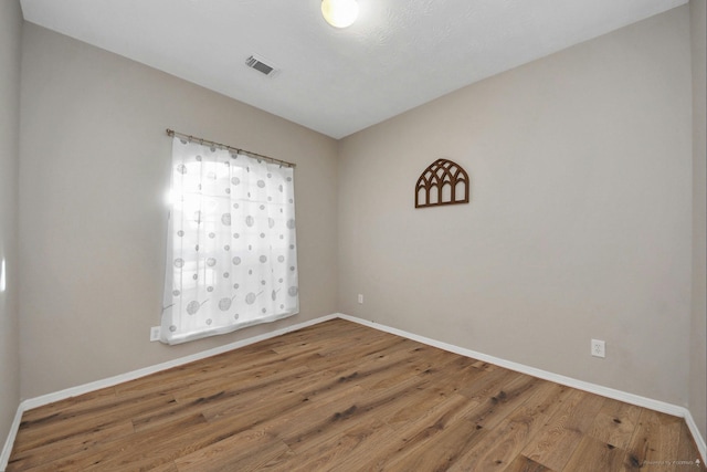 2202 Donrel Way, Houston, TX 77067 - empty room featuring baseboards and wood finished floors