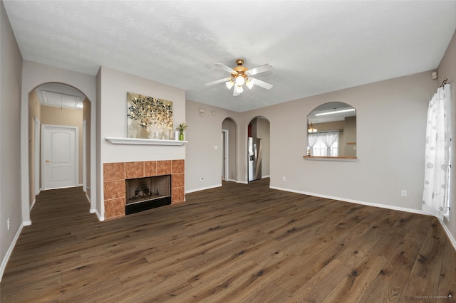 2202 Donrel Way, Houston, TX 77067 - unfurnished living room featuring a ceiling fan, wood-type flooring, and baseboards