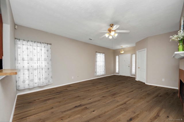 2202 Donrel Way, Houston, TX 77067 - unfurnished living room with ceiling fan, wood finished floors, and baseboards