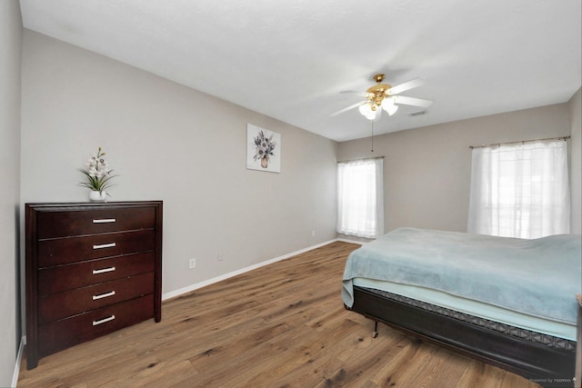 2202 Donrel Way, Houston, TX 77067 - bedroom with wood finished floors, baseboards, and ceiling fan