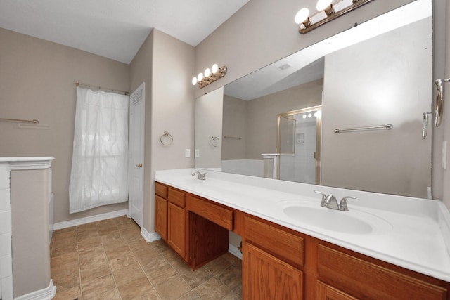 2202 Donrel Way, Houston, TX 77067 - bathroom featuring a shower, double vanity, and baseboards