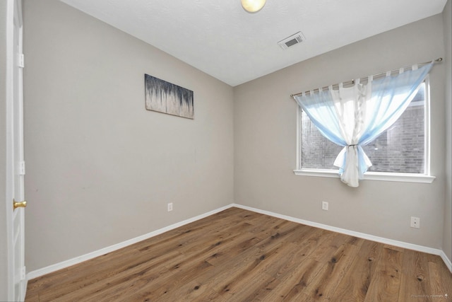 2202 Donrel Way, Houston, TX 77067 - unfurnished room featuring baseboards and wood finished floors