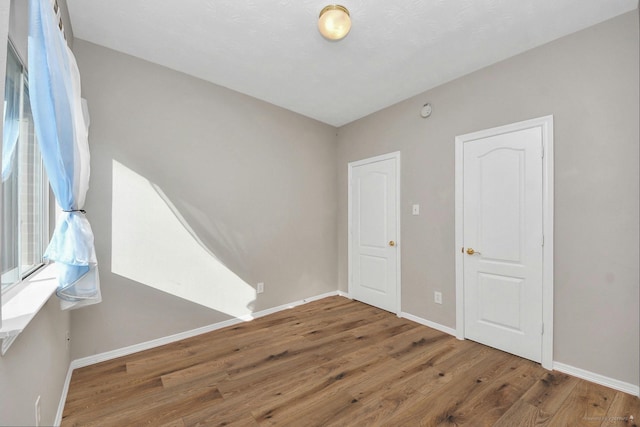 2202 Donrel Way, Houston, TX 77067 - spare room featuring wood finished floors and baseboards