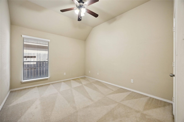 10910 Brighton Gardens Dr, Richmond, TX 77406 - spare room featuring light colored carpet, baseboards, lofted ceiling, and ceiling fan