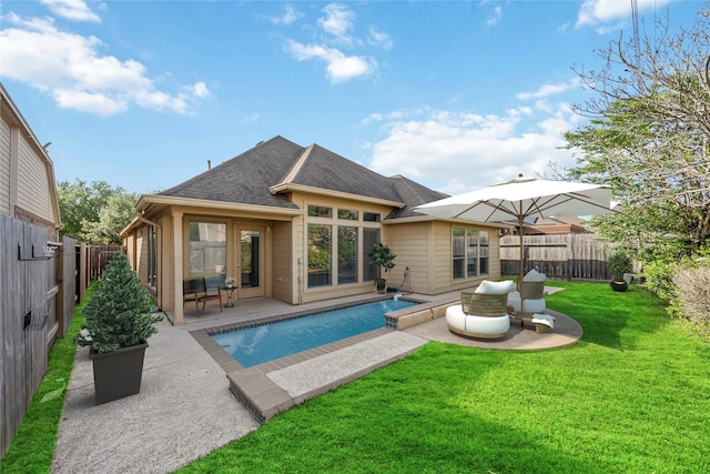 10910 Brighton Gardens Dr, Richmond, TX 77406 - back of house with a patio and a shingled roof