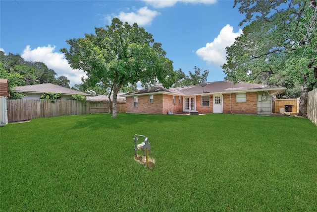 4938 Saxon Dr, Houston, TX 77092 - fenced backyard with french doors
